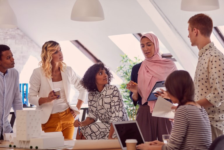 Local government leaders reviewing study data on leadership gaps affecting talent retention and succession planning.