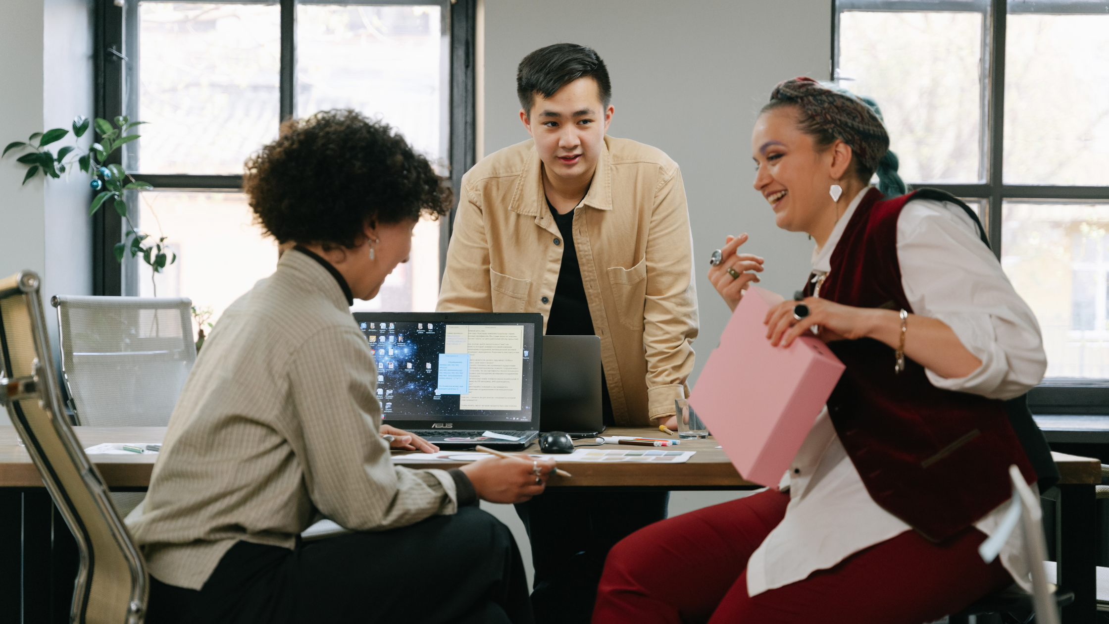 Employees collaborating in a positive workplace culture that supports employee retention